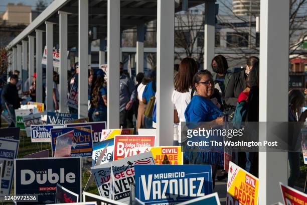 Voters wait in line outside of the Metropolitan Multi-Service Center polling place in Houston, Texas on March 1, 2022.