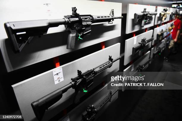 Springfield Armory SAINT M-LOCK AR-15 semi-automatic rifle is displayed on a wall of guns during the National Rifle Association Annual Meeting at the...