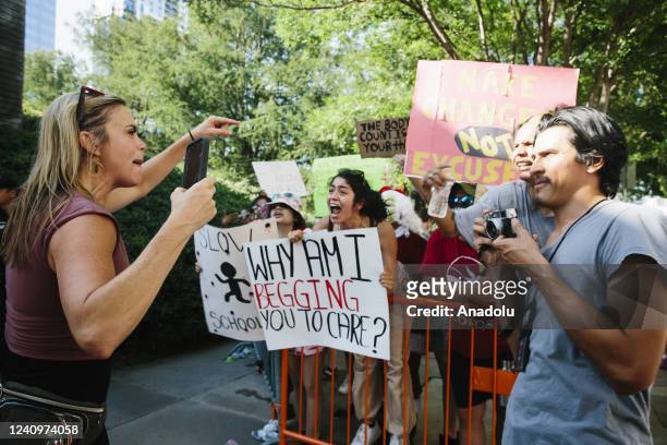 Protesters rallying against guns, argue with a woman who is attending the NRA convention in Houston, Texas, United States on May 28 the days after a...