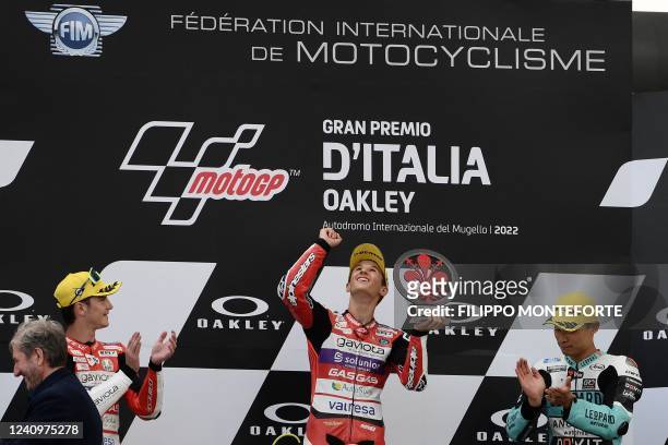 Spain's Sergio Garcia celebrates on the podium after winning the Moto 3 race of the Italian Moto GP Grand Prix at the Mugello race track, Tuscany, on...