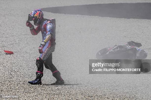 Gresini Racing Ducati's Italian rider Enea Bastianini reacts after crashing during the Italian Moto GP Grand Prix at the Mugello race track, Tuscany,...