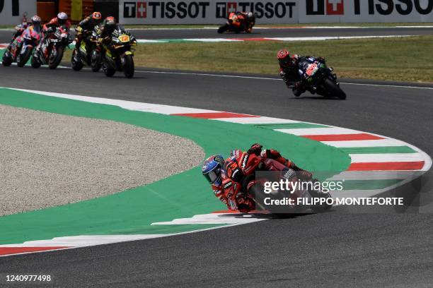 Ducati Lenovo Team Italian rider Francesco Bagnaia , Monster Energy Yamaha's French rider Fabio Quartararo and fellow riders compete during the...