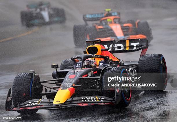 Red Bull Racing's Dutch driver Max Verstappen drives in the rain during a formation lap ahead of a delayed race start at the Monaco Formula 1 Grand...