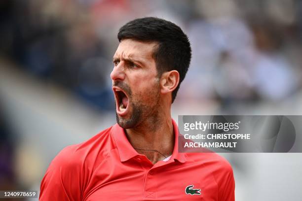 Serbia's Novak Djokovic reacts as he plays against Diego Schwartzman during their men's singles match on day eight of the Roland-Garros Open tennis...
