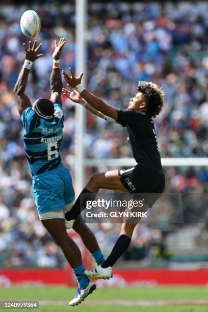 New Zealand's Kitiona Vai and Fiji's Semi Kunatani compete for the ball during the semi-final rugby union match between New Zealand and Fiji on the...