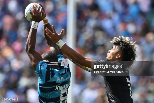 New Zealand's Kitiona Vai and Fiji's Semi Kunatani compete for the ball during the semi-final rugby union match between New Zealand and Fiji on the...