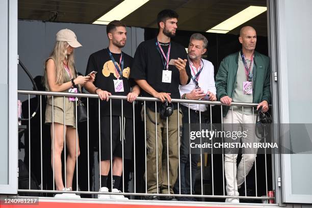 French football coach and former player Zinedine Zidane and his sons football players Theo an Luca watch from a balcony the Monaco Formula 1 Grand...