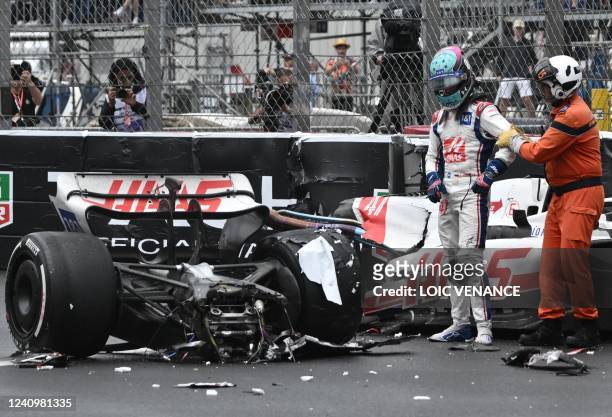 Haas F1 Team's German driver Mick Schumacher exits his car after crashing during the Monaco Formula 1 Grand Prix at the Monaco street circuit in...