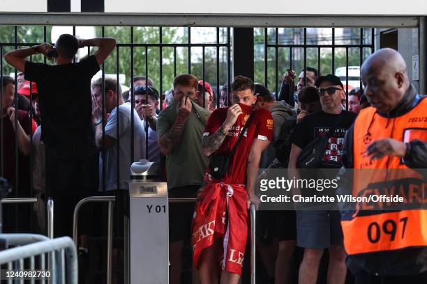 Liverpool fans are held at the gates, many feeling the effects of tear gas ahead of the UEFA Champions League final match between Liverpool FC and...