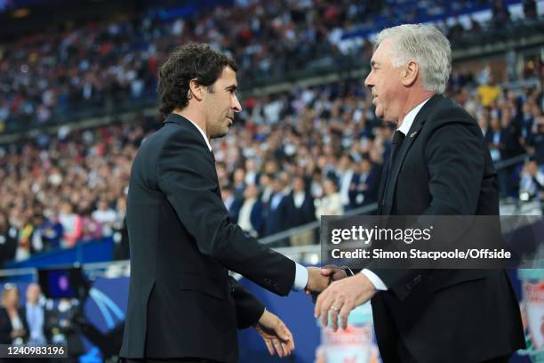 Real Madrid coach Carlo Ancelotti greets former Real Madrid player Raul Gonzalez before the UEFA Champions League final match between Liverpool FC...