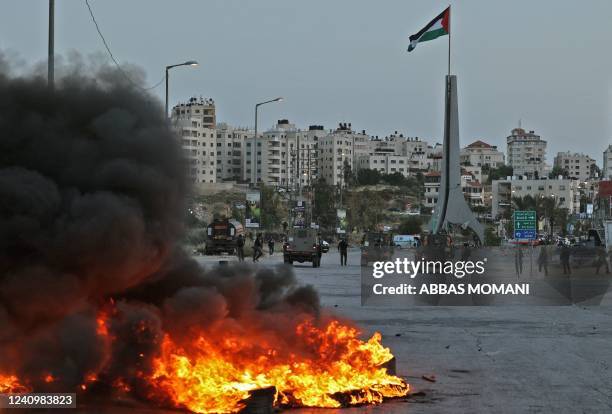 Israeli border guards and their vehicles take position near the Beit El settlement at the northern entrance to the city of Ramallah in the occupied...