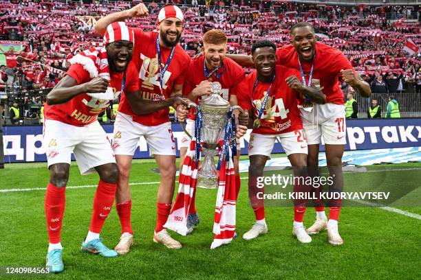 Spartak Moscow's players celebrate with the trophy after winning the Russian cup final football match between Spartak Moscow and Dynamo Moscow at the...