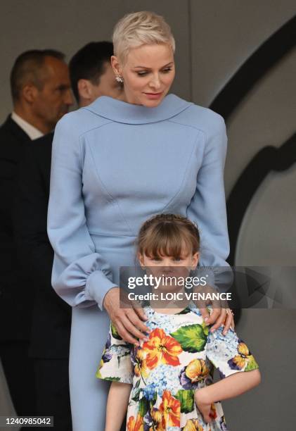 Princess Charlene of Monaco stands with her daughter Gabriella on the podium after the Monaco Formula 1 Grand Prix at the Monaco street circuit in...