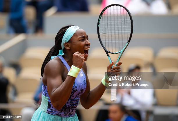 Coco Gauff of the United States celebrates converting match point against Elise Mertens of Belgium in her fourth round match on Day 8 at Roland...