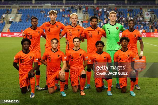 Netherlands' starting eleven pose for a group picture ahead of the 2022 UEFA European Under-17 Championship semi-final football match between...