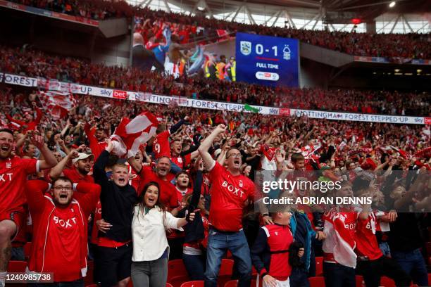 Nottingham Forest's supporters celebrates their team victory at the end of the English Championship play-off final football match between...