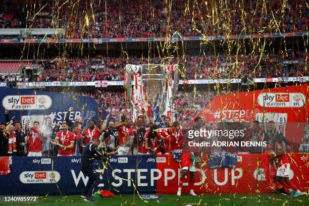 Nottingham Forest's players celebrate with the Championship Playoff trophy after their victory at the end of the English Championship play-off final...