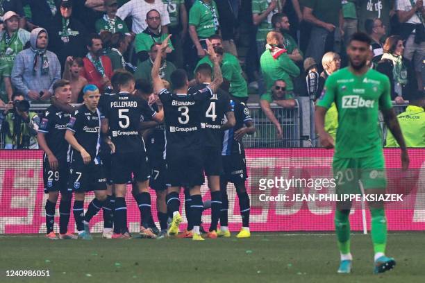 Auxerre's players celebrates after scoring during the French L1-L2 play-off second leg football match between AS Saint-Etienne and AJ Auxerre at the...