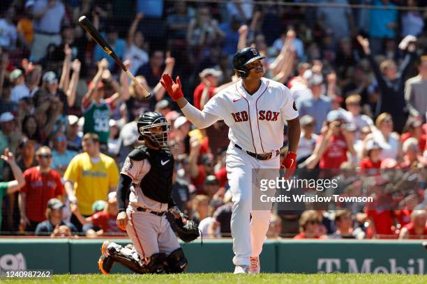 Catcher Robinson Chirinos of the Baltimore Orioles looks on as Rafael Devers of the Boston Red Sox tosses his bat after his home run during the third...
