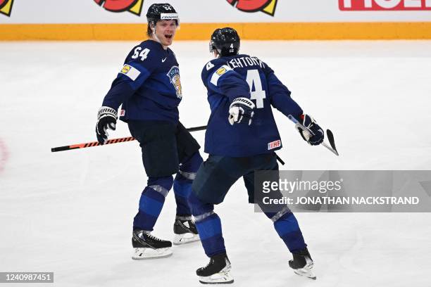 Finland's forward Mikael Granlund celebrates scoring the 2-1 with his team-mate Finland's defender Mikko Lehtonen during the IIHF Ice Hockey World...
