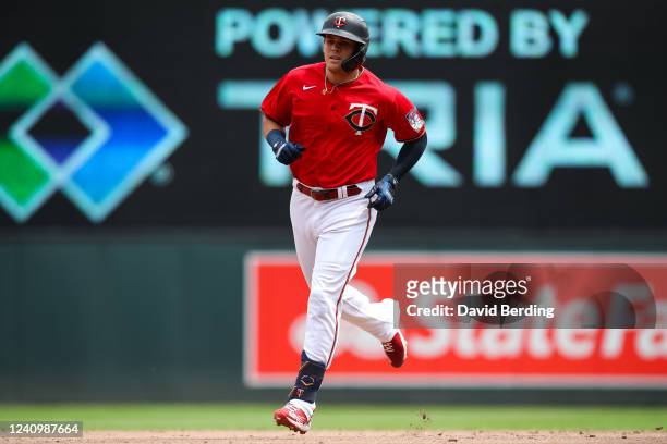 Gio Urshela of the Minnesota Twins rounds the bases on his three-run home run against the Kansas City Royals in the third inning of the game at...