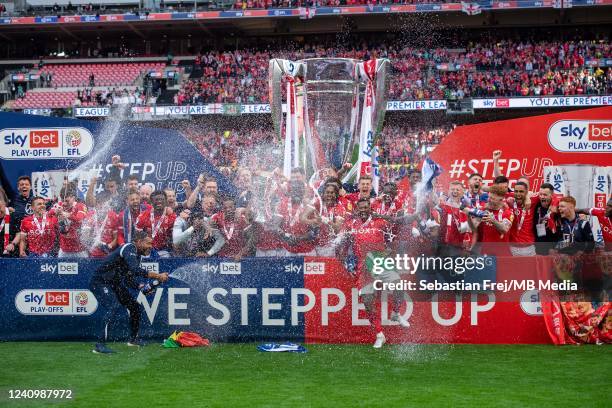 Lewis Grabban of Nottingham Forest holds aloft the Trophy with his team mates during the Sky Bet Championship Play-Off Final match between...