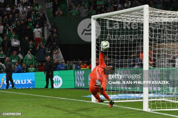 Auxerre's French goalkeeper Donovan Leon makes a save and qualify his team during the penalty shoot-out at the end of the French L1-L2 play-off...
