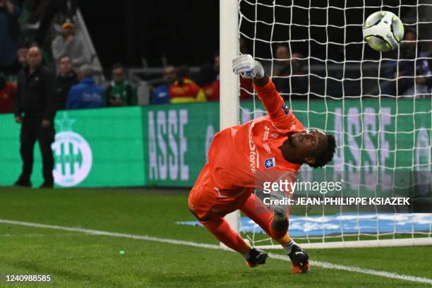 Auxerre's French goalkeeper Donovan Leon makes a save qualifying his team during the penalty shoot-out at the end of the French L1-L2 play-off second...