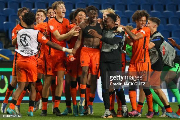 Netherlands' players celebrate winning the 2022 UEFA European Under-17 Championship semi-final football match between Netherlands and Serbia at the...