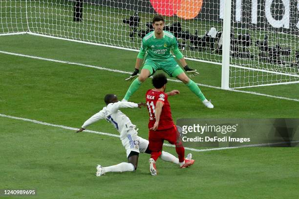 Ferland Mend of Real Madrid CF, Mohamed Salah of Liverpool FC and goalkeeper Thibaut Courtois of Real Madrid CF battle for the ball during the UEFA...