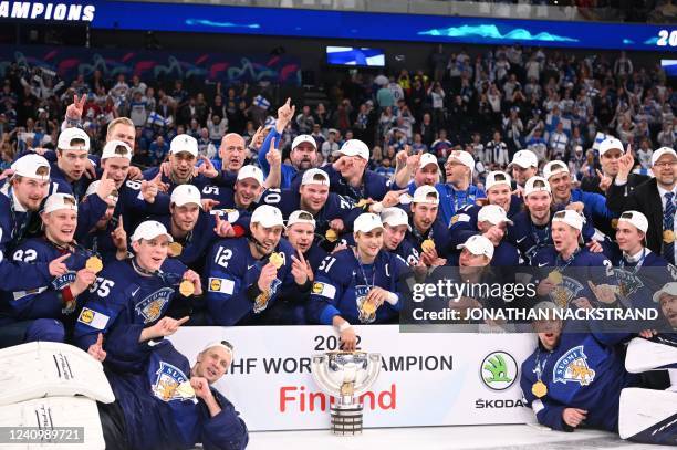 Finland players celebrate with the trophy after the IIHF Ice Hockey World Championships final match between Finland and Canada in Tampere, Finland,...