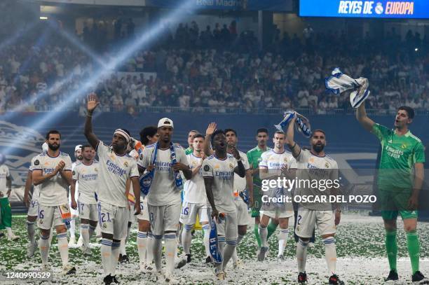 Real Madrid's players wave from the pitch during the club's celebration of their 14th European Cup at the Santiago Bernabeu stadium in Madrid on May...