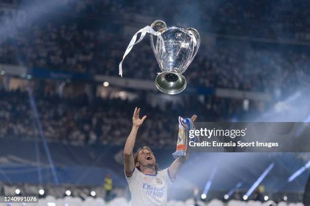 Luka Modric of Real Madrid CF celebrating with his teammates the UEFA Champions League Trophy at Santiago Bernabeu Stadium on May 29, 2022 in Madrid,...