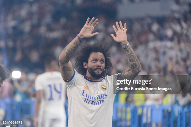 Marcelo Vieira of Real Madrid CF celebrating with his teammates the UEFA Champions League Trophy at Santiago Bernabeu Stadium on May 29, 2022 in...