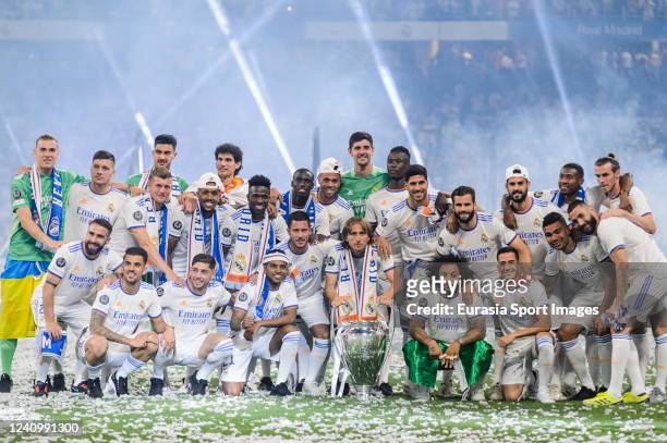 Real Madrid CF squad celebrating with the UEFA Champions League Trophy at Santiago Bernabeu Stadium on May 29, 2022 in Madrid, Spain.