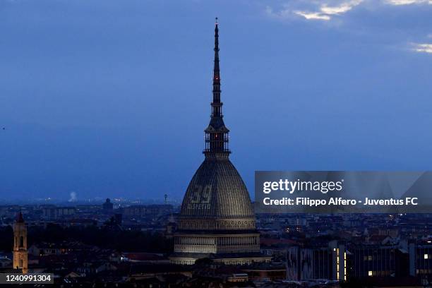 The Mole Antonelliana is illuminated in honor of the victims of the Heysel Stadium disaster on May 29, 2022 in Turin, Italy.