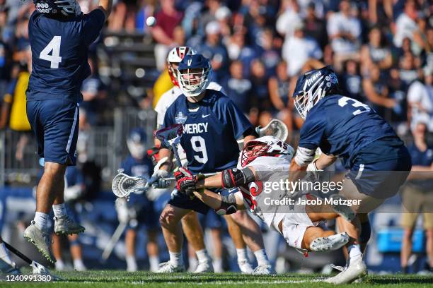 Mercy Mavericks goalie Tommy Umano deflects the shot from Tampa Spartans midfielder Luke McAnaney as attack Augustine Longhitano and midfielder Shane...