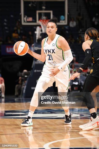 Kayla McBride of the Minnesota Lynx looks to pass the ball during the game against the Los Angeles Sparks on May 29, 2022 at Target Center in...