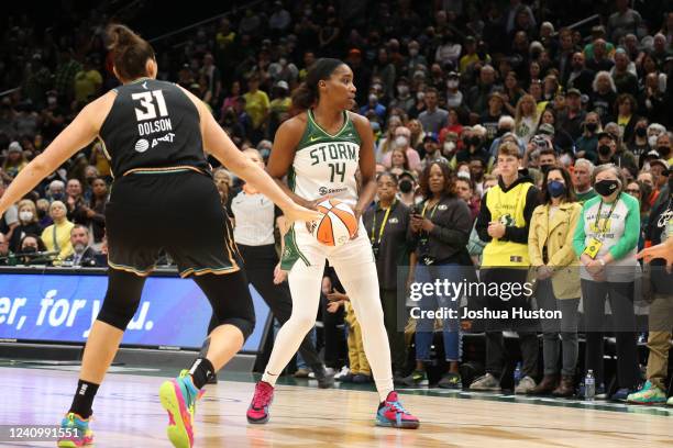 Jantel Lavender of the Seattle Storm looks to pass the ball during the game against the New York Liberty on May 29, 2022 at Climate Pledge Arena in...