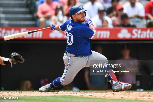 Toronto Blue Jays catcher Alejandro Kirk with a run scoring single during the MLB game between the Toronto Blue Jays and the Los Angeles Angels of...