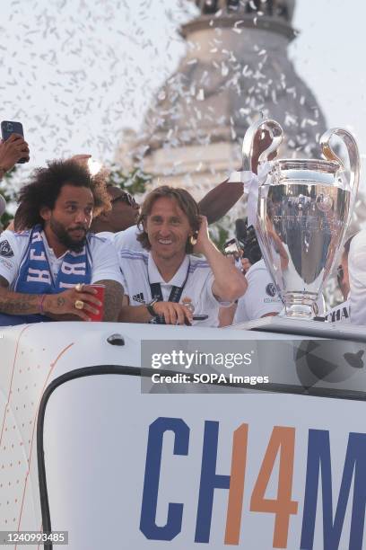Marcelo Vieira and Luka Modric arrive at the traditional celebration at Cibeles, where thousands of fans celebrate the 14th UEFA Champions League...