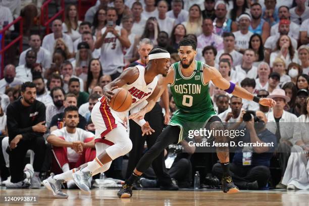 Jayson Tatum of the Boston Celtics plays defense on Jimmy Butler of the Miami Heat during Game 7 of the 2022 NBA Playoffs Eastern Conference Finals...