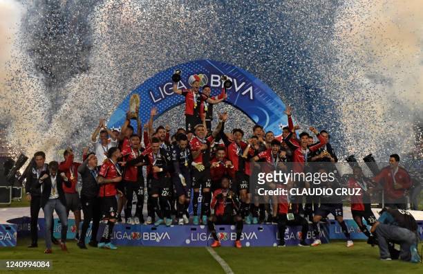 Atlas players celebrate after winning the Mexican Clausura 2022 tournament final football match against Pachuca at the Hidalgo stadium in Pachuca,...