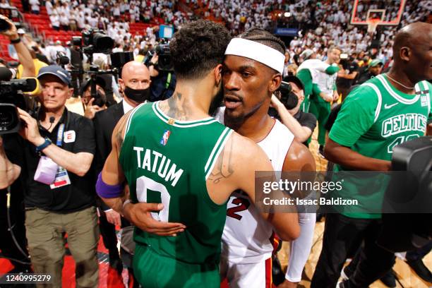 Jayson Tatum of the Boston Celtics embraces Jimmy Butler of the Miami Heat after Game 7 of the 2022 NBA Playoffs Eastern Conference Finals on May 29,...