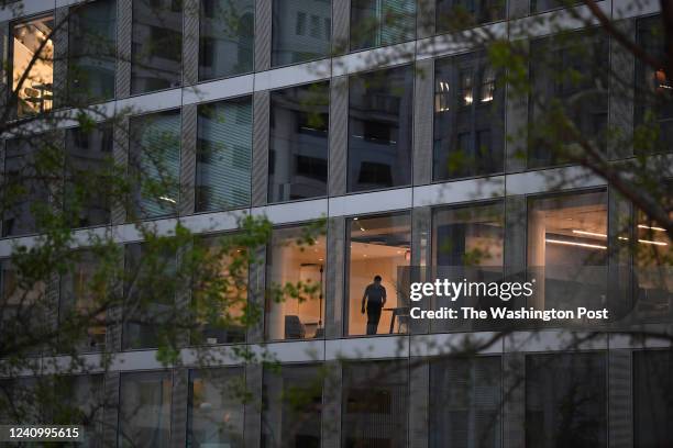 Person is seen in an office building along 13th Street NW on Monday April 25, 2022 in Washington, DC. The pandemic has had an effect on some...