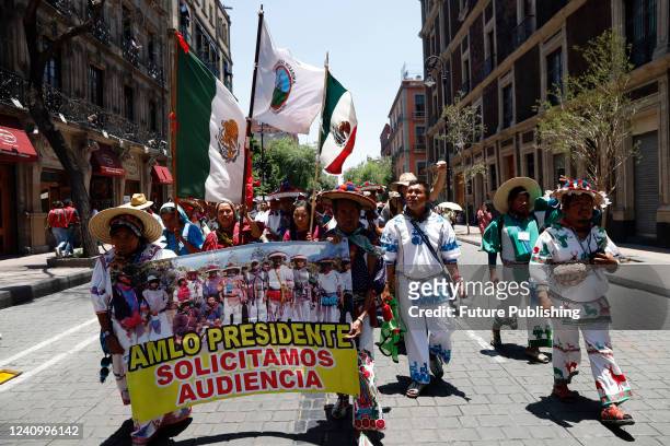 Members of the Wixarika Caravan for Dignity and Conscience take part in a demonstration outside the National Palace, to request a meeting with...