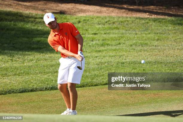 Brian Stark of the Oklahoma State Cowboys chips on the green during the Division I Men's Golf Championship held at the Grayhawk Golf Club on May 29,...