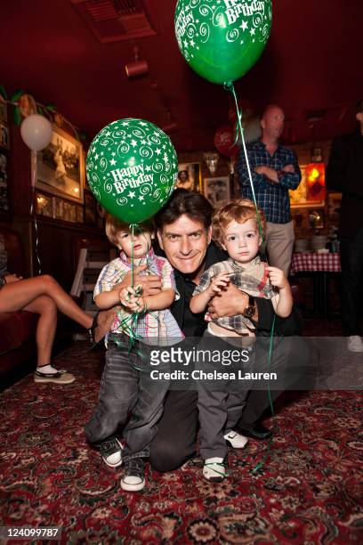 Actor Charlie Sheen poses with sons Max Sheen and Bob Sheen at his birthday celebration with family at Buca di Beppo on September 3, 2011 in Encino,...
