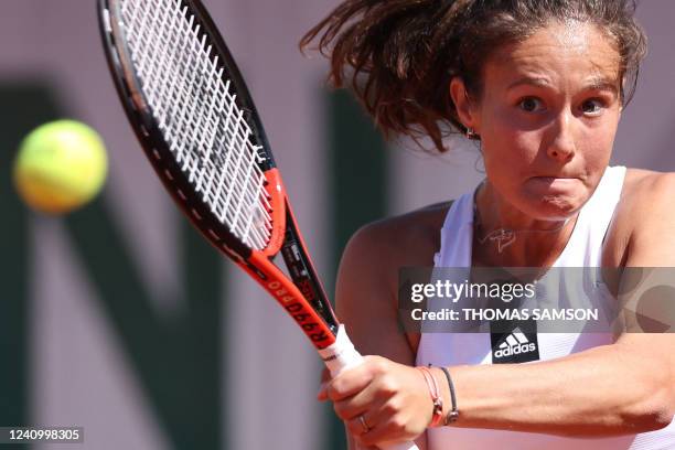 Russia's Daria Kasatkina plays a backhand return to Italy's Camila Giorgi during their women's singles match on day nine of the Roland-Garros Open...