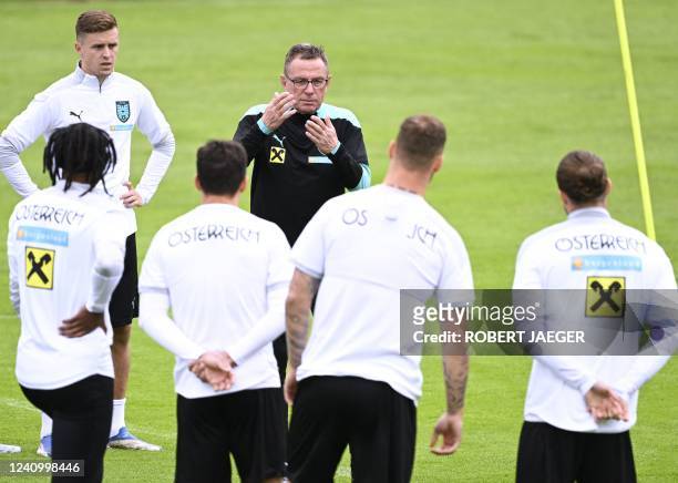 Austria's German national football team head coach Ralf Rangnick talks with his players during a training session on May 30, 2022 in Bad...